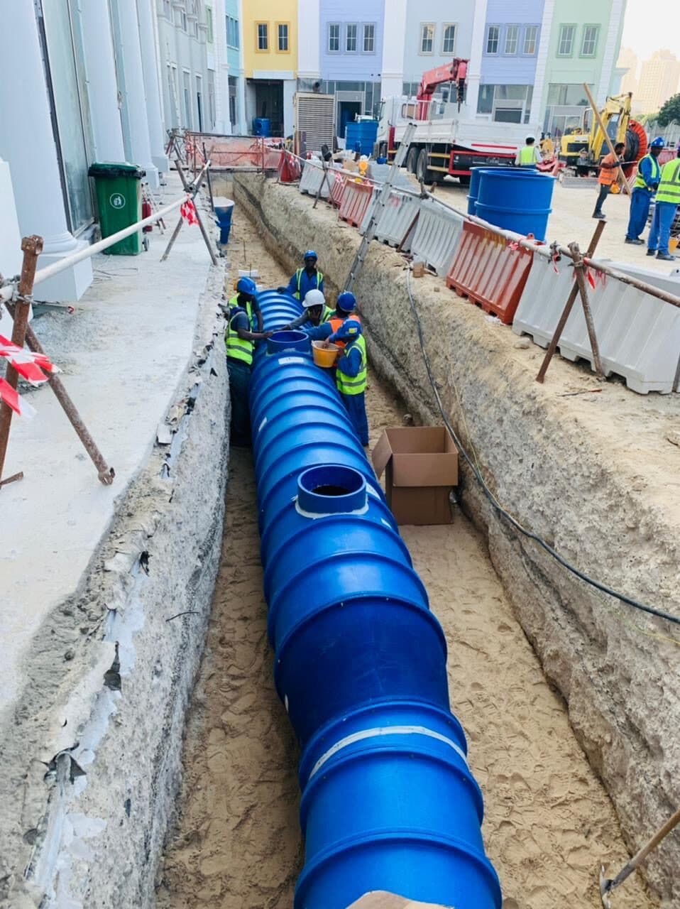 HDPE duct being laid in the courtyard trench